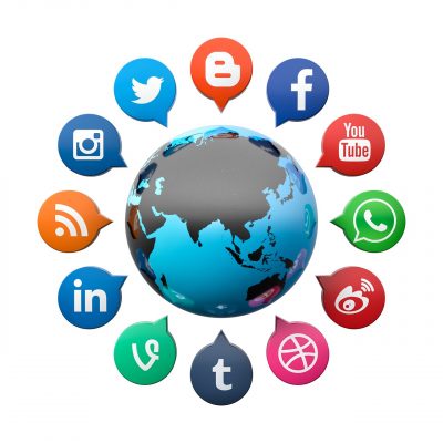 Image of the earth is encircled by icons of social media and technology.