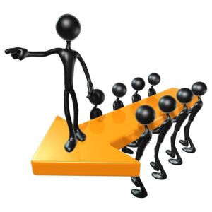 Black stick figures standing on an orange arrow, with one figure at the front pointing forward and others following in a line.
