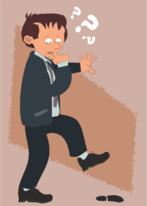 Cartoon character in a suit looking confused, with question marks above the head. The character holds one hand to the mouth and raises one leg, appearing about to step into a hole in the ground.
