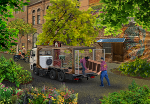 Street scene with a truck carrying household items such as a washing machine, armchair, and grandfather clock. Two men are handling a piece of furniture near the truck. A mural is visible on a brick wall in the background, and a person is riding a bicycle nearby. The area is surrounded by greenery and colorful flowers.